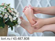 Beautiful female foot closeup, corns and calluses on feet, dry skin on legs, cracked heels, barefoot woman relaxing on sofa. Стоковое фото, фотограф Станислав Тарко / Фотобанк Лори