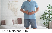 Stomach ulcer, man with abdominal pain suffering at home, symptoms of gastritis, diseases of the digestive system, health problems concept. Стоковое видео, видеограф Станислав Тарко / Фотобанк Лори