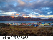 Picturesque autumn arctic landscape. A small northern port town located in the tundra among the mountains on the shore of a sea bay. Egvekinot, Chukotka, Siberia, Far North of Russia. Polar region. (2013 год). Стоковое фото, фотограф Андрей Степанов / Фотобанк Лори