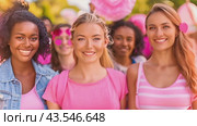 Happy women participating in a Pink Ribbon awareness event, symbolizing their support for breast cancer research and education. Стоковое AI-видео, аниматор Данила Большаков / Фотобанк Лори