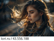 A beautiful, young woman with a thoughtful look. The hair develops in the wind and gives a feeling of lightness and naturalness. Стоковое AI-изображение, AI-художник Photojuli / Фотобанк Лори