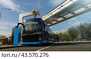 Blue electric bus at the charging station.Modern trains on the monorail. Стоковое фото, фотограф Андрей Шалари / Фотобанк Лори