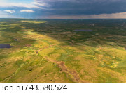 Arctic tundra in summer from an altitude of 2000 meters. Cloudy sky. Variety of colors and landscapes. The vastness of pristine nature. Shadow from the clouds. Стоковое фото, фотограф Владимир Ендовицкий / Фотобанк Лори