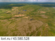 Arctic tundra in summer from an altitude of 2000 meters. Cloudy sky. Variety of colors and landscapes. The vastness of pristine nature. Shadow from the clouds. Стоковое фото, фотограф Владимир Ендовицкий / Фотобанк Лори