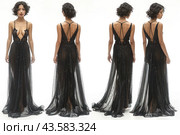 Young woman in an elegant black evening dress. The dress is made of sheer fabric, embellished with sequins, which gives it a sophisticated and stylish look. The photo shows both the front and back views of the dress, allowing you to see it from all angles. The dress has a deep cut at the front and open shoulders. The back of the dress also has a plunging neckline with intersecting straps. The woman poses against a light background, which allows you to better see the details of the outfit. Стоковое AI-изображение, AI-художник Анна Кривицкая / Фотобанк Лори
