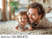 Happy Father and Toddler Son Play on Carpeted Floor. Стоковое AI-изображение, AI-художник Сергей Толмачёв / Фотобанк Лори