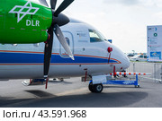 BERLIN - JUNE 07, 2024: The turboprop-powered commuter airliner Dornier 328-120. Flying hydrogen test lalolatory by DLR (German Aerospace Center). ILA Berlin Air Show 2024. Редакционное фото, фотограф Sergey Kohl / Фотобанк Лори
