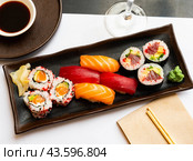 Popular Japanese dish sushi combo, which includes of Uramakis, Makis and Nigiris. Стоковое фото, фотограф Яков Филимонов / Фотобанк Лори