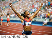 An African-American black athlete won during a sprint race or running at a sporting event. The concept of the Summer Olympic Games. Стоковое AI-изображение, AI-художник Photojuli / Фотобанк Лори