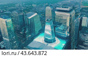 Tall skyscrapers dominate the cityscape with sleek facades and a commanding presence. Стоковое AI-видео, аниматор Юрий Поздников / Фотобанк Лори