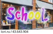 The interior of the store, full of school supplies, with letters that form the word SCHOOL, creates an atmosphere of educational inspiration. Стоковое AI-видео, аниматор Юрий Поздников / Фотобанк Лори