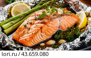 A close up of a piece of salmon with asparagus and lemon, AI. Стоковое AI-изображение, AI-художник Сергей Старуш / Фотобанк Лори