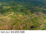 Arctic tundra in summer from an altitude of 2000 meters. Variety of colors and landscapes. The vastness of pristine nature. Shadow from clouds. Стоковое фото, фотограф Владимир Ендовицкий / Фотобанк Лори