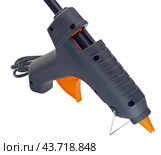 Клеевой пистолет на белом фоне. Electric hot glue gun isolated on white background. Стоковое фото, фотограф Татьяна Д / Фотобанк Лори