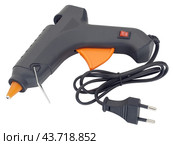 Клеевой пистолет на белом фоне. Electric hot glue gun isolated on white background. Стоковое фото, фотограф Татьяна Д / Фотобанк Лори
