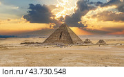 Pyramid of Menkaure. Ancient Pyramid Against Sky. Pyramid of Menkaure and Pyramids of Queens, Cairo. The Pyramid of Menkaure is the smallest of the three main Pyramids of Giza (2021 год). Стоковое фото, фотограф Павел Муравьев / Фотобанк Лори