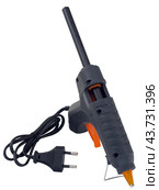 Клеевой пистолет на белом фоне. Electric hot glue gun isolated on white background. Стоковое фото, фотограф Татьяна Д / Фотобанк Лори