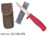 Точильный камень и нож на белом фоне. Sharpener stone and knife isolated on white background. Стоковое фото, фотограф Татьяна Д / Фотобанк Лори