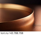 A close-up of bronze surface with a gradient, featuring curved lines and subtle light reflections. The texture of the bronze is smooth and metallic, creating a visually captivating abstract image. AI. Стоковое AI-изображение, AI-художник Юлия Петровская / Фотобанк Лори