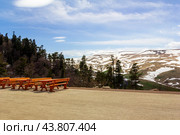Outdoor cafe area with benches and tables overlooking the Lago Naki mountain plateau in Adygea. Стоковое фото, фотограф Андрей С / Фотобанк Лори