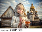The concept of the Russian Orthodox holiday Honey Savior. A beautiful little girl in Russian national clothes and a scarf with a jar of honey on the background of an Orthodox church. Стоковое AI-изображение, AI-художник Photojuli / Фотобанк Лори