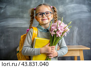 A sweet, beautiful first-grader girl with glasses. In the hands of a bouquet of flowers. The child goes to school for the first time. A child with a backpack, a book and flowers. Back to school. Стоковое AI-изображение, AI-художник Photojuli / Фотобанк Лори
