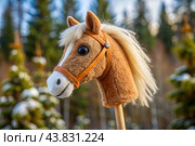 Hobbyhorsing. A new kind of sport. A stick with a horse's head to simulate a horse race. Стоковое AI-изображение, AI-художник Photojuli / Фотобанк Лори