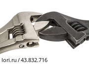 Разводные гаечные ключи на белом фоне. An adjustable wrench on a white background. Стоковое фото, фотограф Татьяна Д / Фотобанк Лори