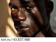Intense portrait of a perspiring man in sunlight. Стоковое AI-изображение, AI-художник Иван Рябоконь / Фотобанк Лори