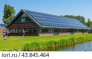 Solar battery on the roof of house near Electrical towers. PV plants generate your own electricity plug play. Power photovoltaic plant. Solar Panel energy system. Стоковое AI-изображение, AI-художник Ирина Михайличенко / Фотобанк Лори