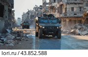 A military machine moves along the road of the destroyed city. Стоковое AI-видео, аниматор Юрий Поздников / Фотобанк Лори