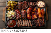 Delicious Barbecue Feast Displayed on a Wooden Table Featuring Various Meats and Sauces. Стоковое AI-изображение, AI-художник Сергей Толмачёв / Фотобанк Лори