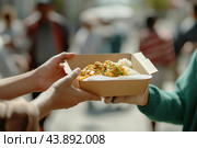 Handing Over Delicious Street Food With Rice in a Busy Urban Environment During Daytime. Стоковое AI-изображение, AI-художник Сергей Толмачёв / Фотобанк Лори
