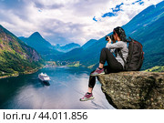 Geiranger fjord, Beautiful Nature Norway panorama. Nature photographer tourist with camera shoots. Стоковое фото, фотограф Андрей Армягов / Фотобанк Лори