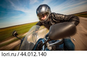 Biker racing on the road. Стоковое фото, фотограф Андрей Армягов / Фотобанк Лори