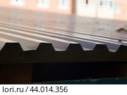 Corrugated board on the roof of the house.Protection of the house from precipitation. Стоковое фото, фотограф Александр Поташев / Фотобанк Лори