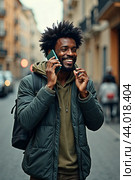 A contented black man talking on a cell phone on a city street. AI generative. Стоковое AI-изображение, AI-художник Роман Дзюбало / Фотобанк Лори
