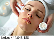 A cosmetologist applies a healing cream to the face of a young girl during cosmetic procedures in a beauty salon. Стоковое AI-изображение, AI-художник Ярославский Максим / Фотобанк Лори