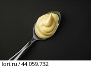 A large boat with mayonnaise on a black background. The concept of the sauce. Стоковое фото, фотограф Ярославский Максим / Фотобанк Лори