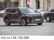 Fast moving Exeed VX on the city road. Black SUV with man driving. Chinese auto in fast motion with blurred background. Speeding in the city concept. Редакционное фото, фотограф Константин Григорьев / Фотобанк Лори