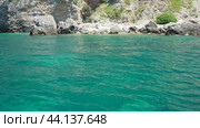 Cave Pecin bay Budva Montenegro. Rocks near Buljarica. Stones, inaccessible rocks. Flysch marine rocks lithological layers. Adriatic Mediterranean sea blue green water. Nature park Katici. (2024 год). Стоковое видео, видеограф Юлия Петровская / Фотобанк Лори