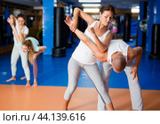 Woman exercising armlock. Стоковое фото, фотограф Яков Филимонов / Фотобанк Лори