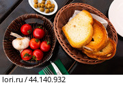 Toasted white bread, tomatoes, garlic and olives for Pan con tomate. Стоковое фото, фотограф Яков Филимонов / Фотобанк Лори