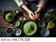 Hands whisking matcha powder in a bowl during a tea ceremony. Стоковое AI-изображение, AI-художник Иван Рябоконь / Фотобанк Лори