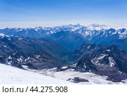Top view of the high mountains above the clouds from the slope of Mount Elbrus. Стоковое фото, фотограф Евгений Харитонов / Фотобанк Лори
