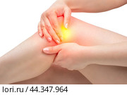 Woman suffering from pain in knee. Tendon problems and Joint inflammation on white background. young women knee ache, healthcare concept. Стоковое фото, фотограф Павел Муравьев / Фотобанк Лори