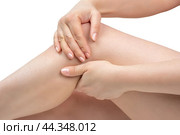 Joint pain. Knees pain, hands painful point. Young woman having knee pain. tendon problems and joint inflammation on white background. Стоковое фото, фотограф Павел Муравьев / Фотобанк Лори