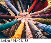Group of friends forming a huddle. Стоковое AI-изображение, AI-художник Veniamin Kraskov / Фотобанк Лори