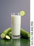 Glass of milk with fresh cucumber. Стоковое AI-изображение, AI-художник Veniamin Kraskov / Фотобанк Лори