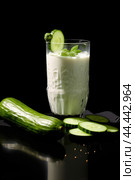Glass of milk with fresh cucumber. Стоковое AI-изображение, AI-художник Veniamin Kraskov / Фотобанк Лори